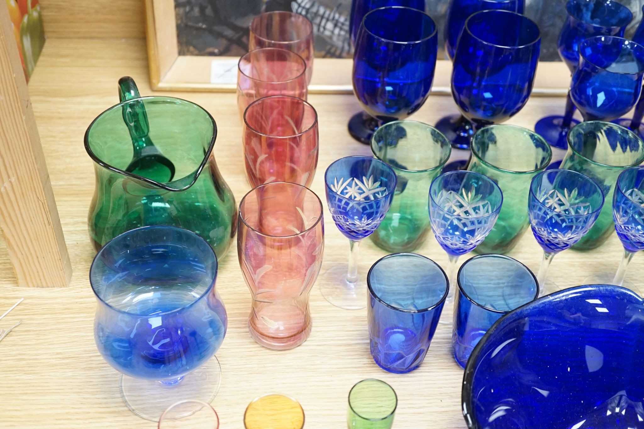 A mixed group of coloured glassware